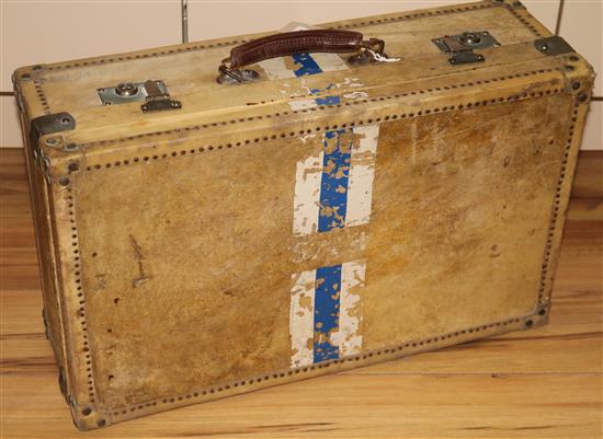 A white vellum travelling suitcase